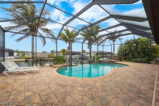 view of pool with a boat dock, a water view, glass enclosure, and a patio area