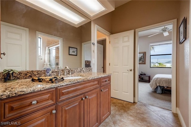 bathroom featuring tile patterned floors, ceiling fan, vanity, and walk in shower