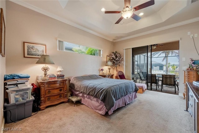 carpeted bedroom featuring a tray ceiling, ceiling fan, access to outside, and ornamental molding