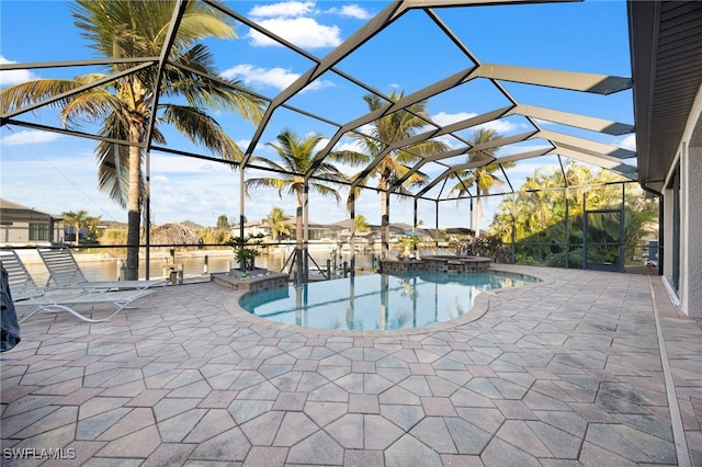 view of swimming pool featuring a lanai, a patio, and a water view