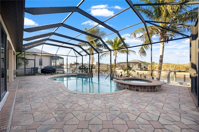 view of swimming pool featuring glass enclosure, grilling area, a water view, an in ground hot tub, and a patio area