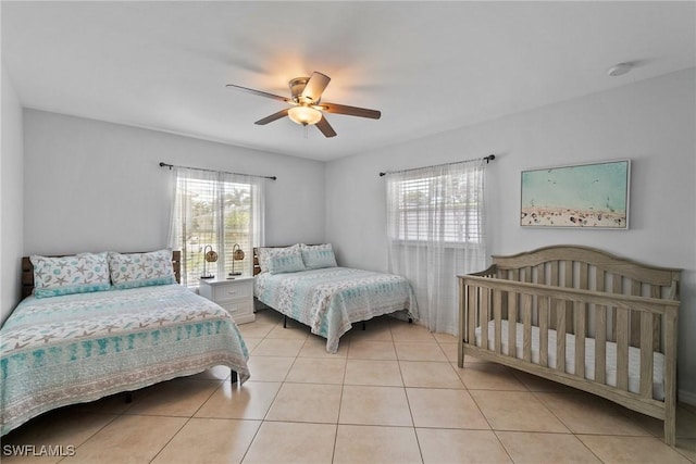 bedroom featuring ceiling fan and light tile patterned floors