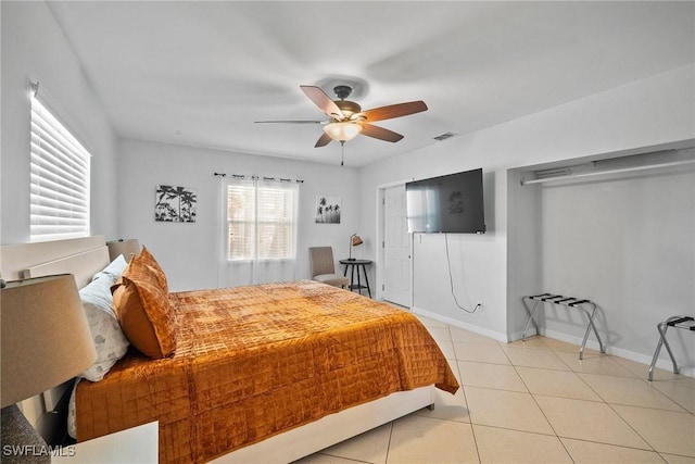 bedroom with light tile patterned floors and ceiling fan