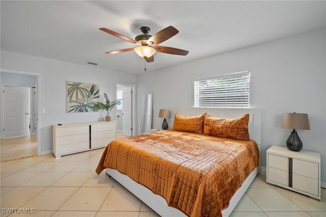 tiled bedroom with ceiling fan