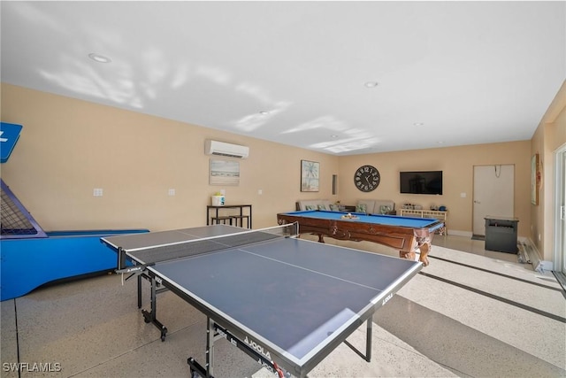 recreation room with a wall mounted AC and pool table