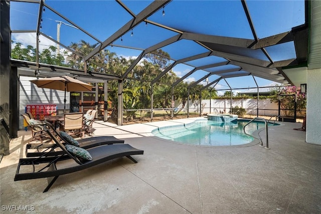 view of swimming pool with a patio and a lanai