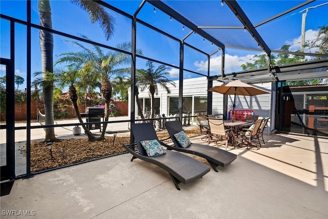 view of patio / terrace featuring a lanai