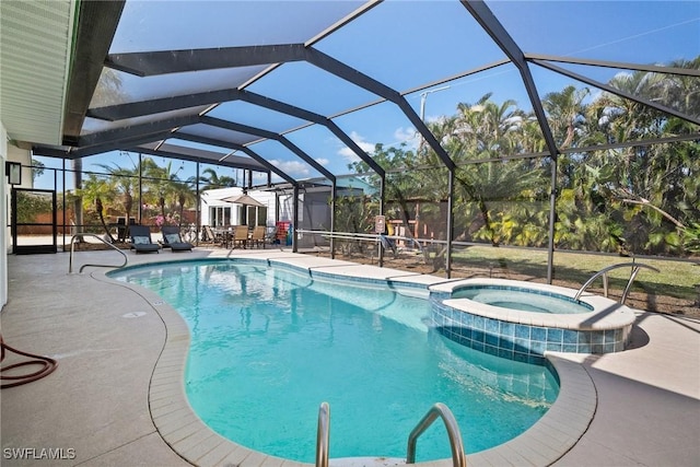 view of pool with a patio area and a lanai