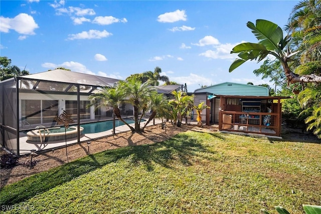 view of yard featuring a swimming pool with hot tub and a lanai