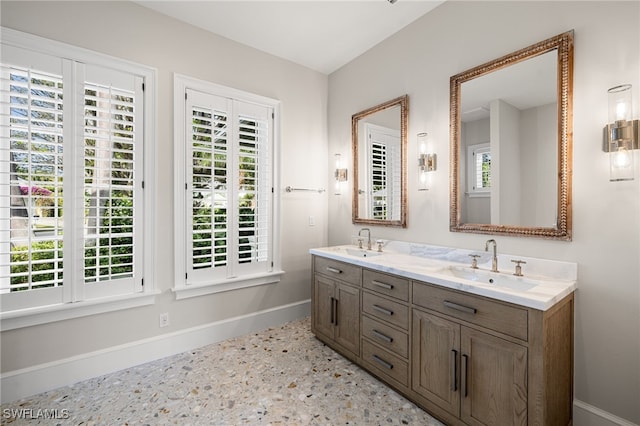 bathroom featuring vanity and a healthy amount of sunlight