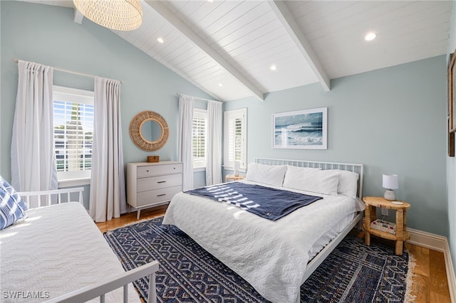 bedroom featuring vaulted ceiling with beams and wood-type flooring