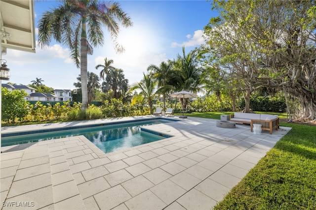 view of swimming pool with a patio area