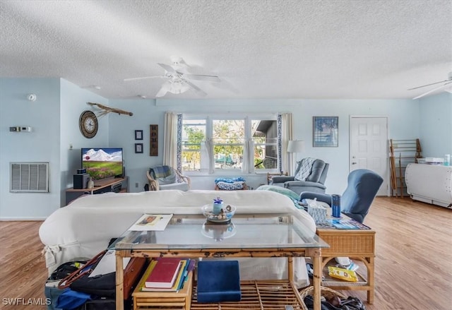 1291 Chokoloskee Dr, Chokoloskee, FL 34138 - living room with ceiling fan, a textured ceiling, and light wood-type flooring