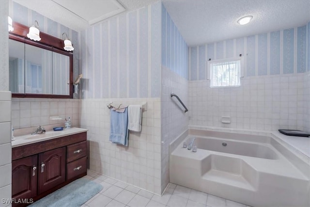 1291 Chokoloskee Dr, Chokoloskee, FL 34138 - bathroom featuring vanity, tile patterned floors, a bathing tub, a textured ceiling, and tile walls