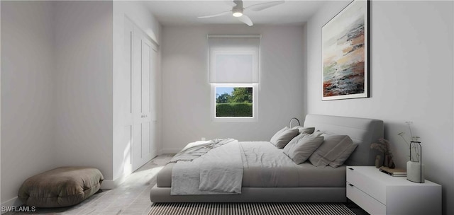 bedroom with ceiling fan and a closet