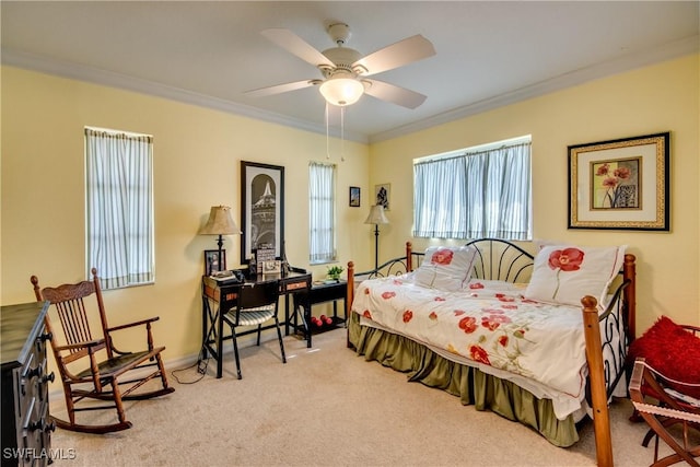 bedroom with ceiling fan, light colored carpet, and ornamental molding