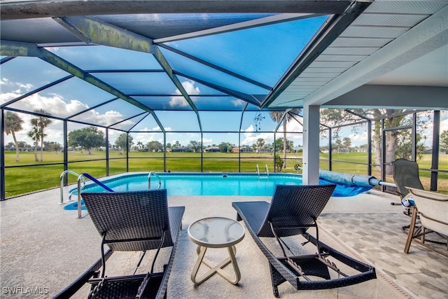 view of swimming pool featuring a lanai, a patio area, and a lawn