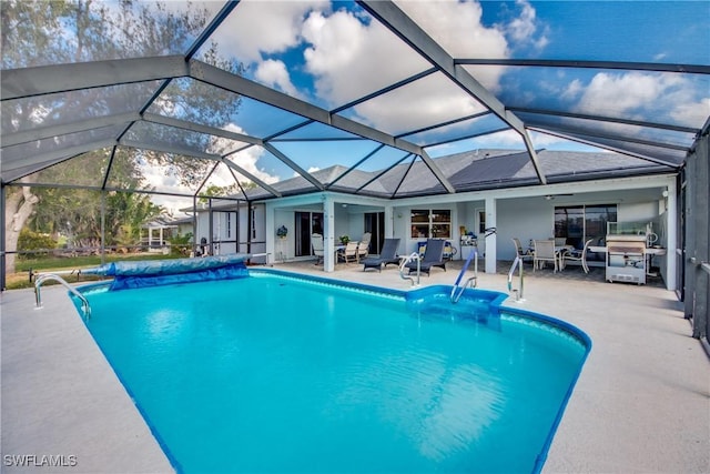 view of pool with a lanai and a patio area