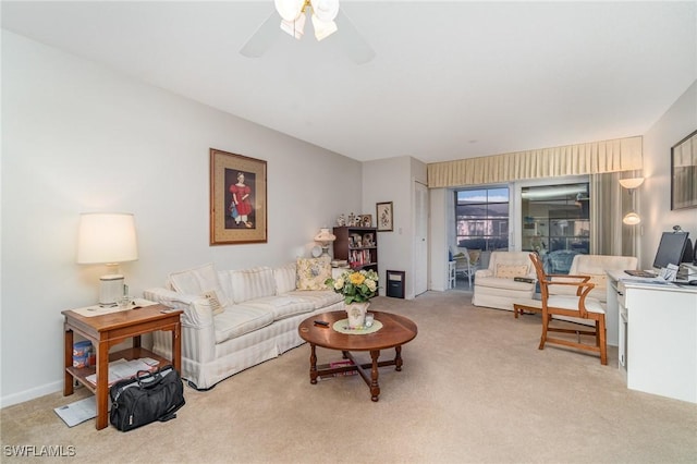 living room featuring light carpet and ceiling fan