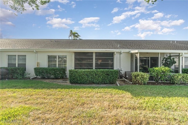 rear view of house with a lawn