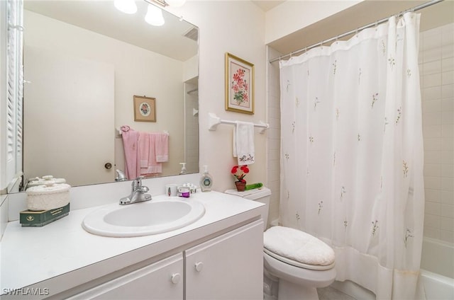 full bathroom with shower / bath combo, vanity, and toilet