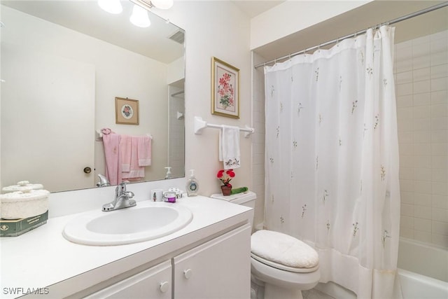 full bathroom featuring vanity, toilet, and shower / bath combo with shower curtain