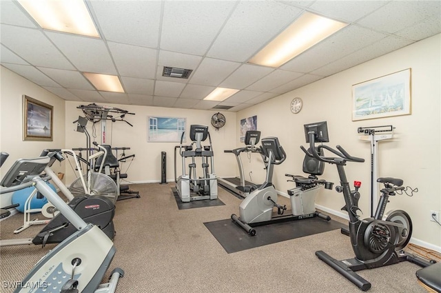 workout area with a paneled ceiling