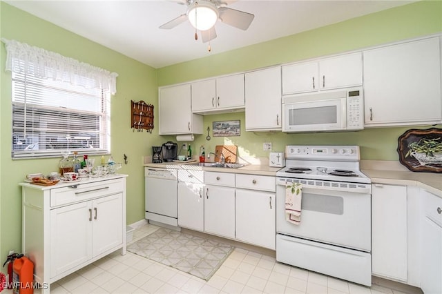 kitchen with white cabinets, white appliances, ceiling fan, and sink