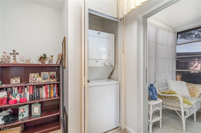 washroom with stacked washer / dryer