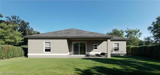 back of property with a patio area and a lawn