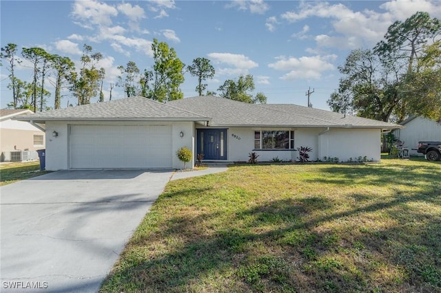 ranch-style house with a front yard and a garage