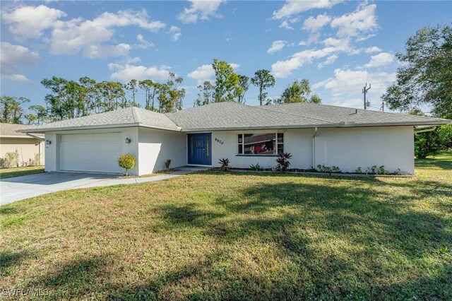 ranch-style home with a front yard and a garage