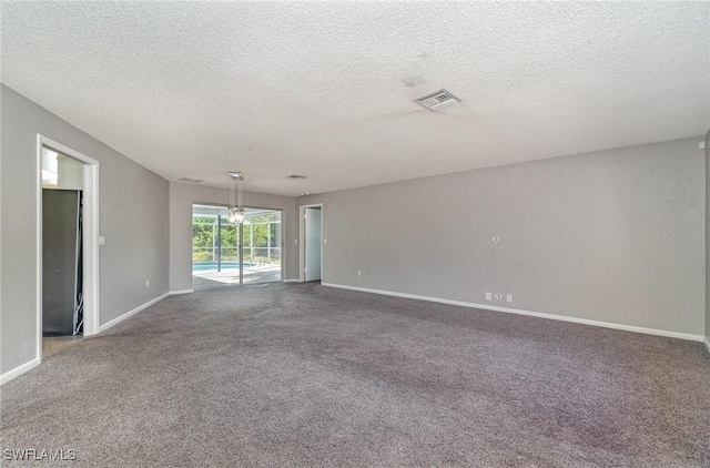 spare room featuring a textured ceiling