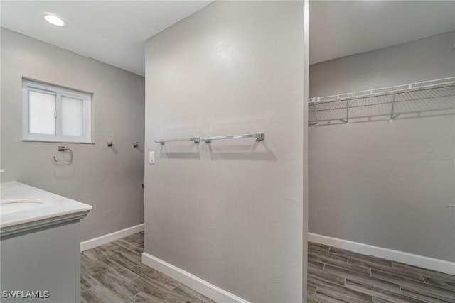 bathroom with hardwood / wood-style flooring and vanity