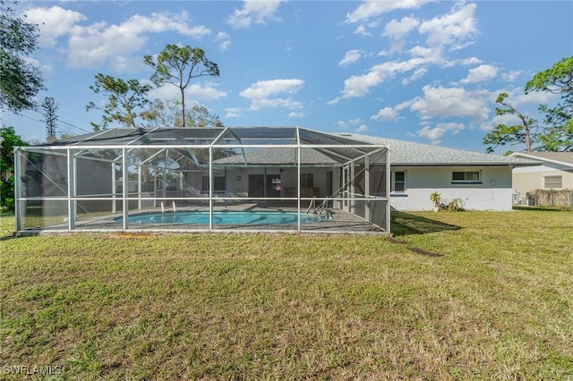 rear view of house featuring a yard and a lanai