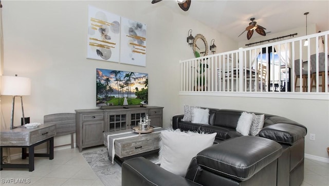 tiled living room with ceiling fan