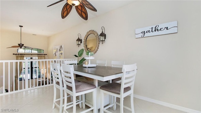 tiled dining area with ceiling fan