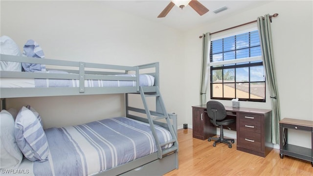 bedroom with ceiling fan and light hardwood / wood-style flooring