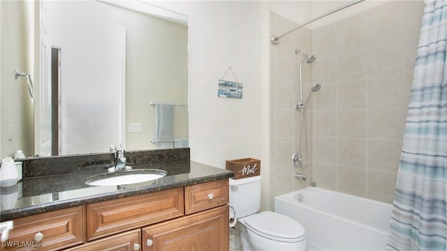 full bathroom featuring vanity, shower / tub combo, and toilet