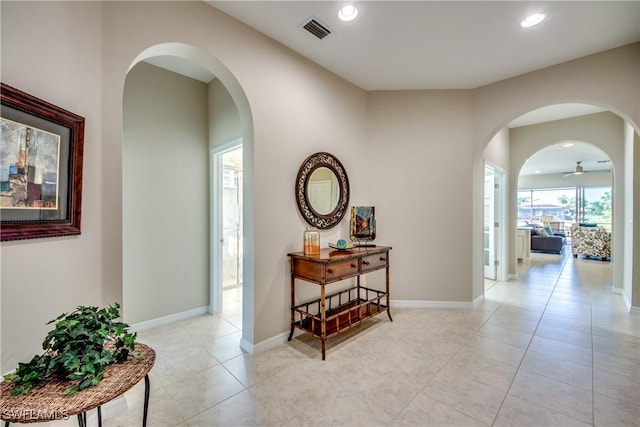 hallway featuring light tile patterned floors