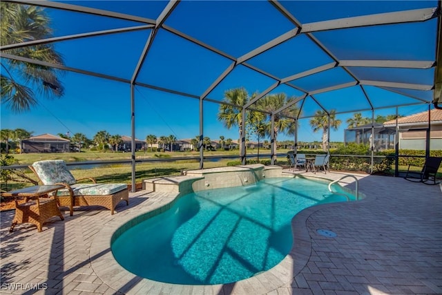 view of pool featuring a patio and glass enclosure