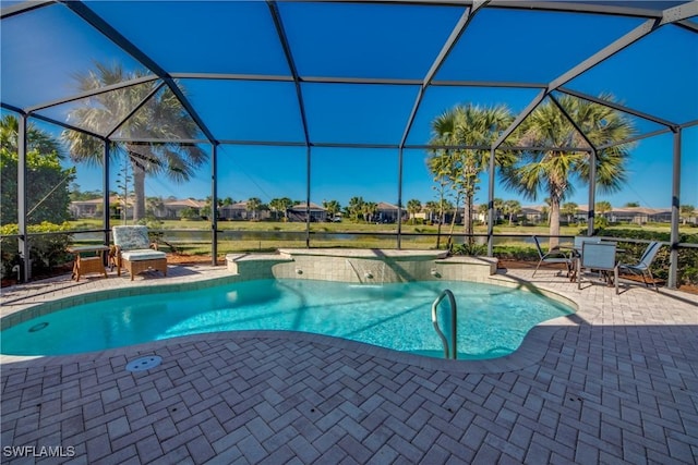 view of swimming pool featuring a lanai and a patio area