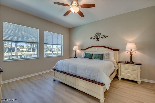 bedroom with light hardwood / wood-style flooring and ceiling fan