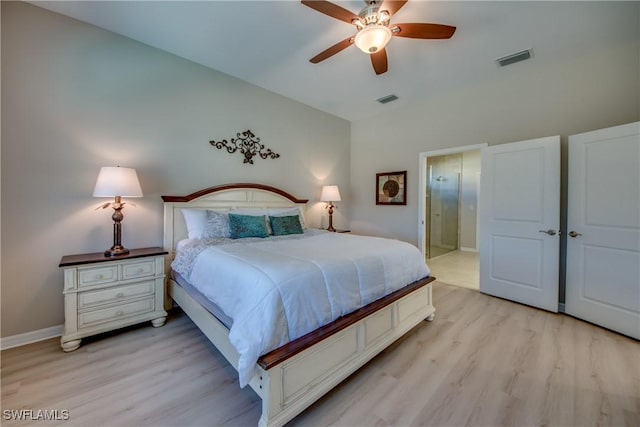 bedroom featuring ceiling fan, vaulted ceiling, and light hardwood / wood-style flooring