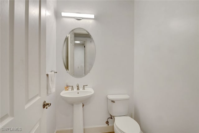 bathroom with sink and toilet