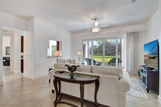 living room with ceiling fan, light tile patterned flooring, and crown molding