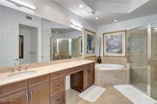 bathroom featuring tile patterned flooring, vanity, and plus walk in shower