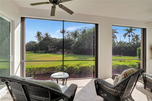 sunroom / solarium with ceiling fan and a healthy amount of sunlight