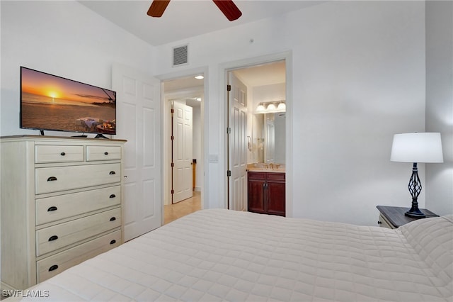 bedroom featuring ceiling fan, sink, and connected bathroom