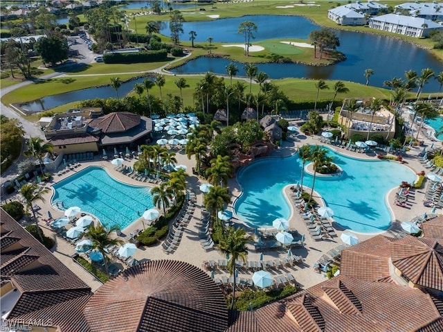 view of swimming pool with a water view